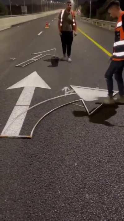 Painting road sign