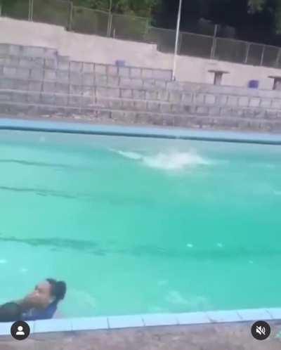 Trying to jump into a swimming pool