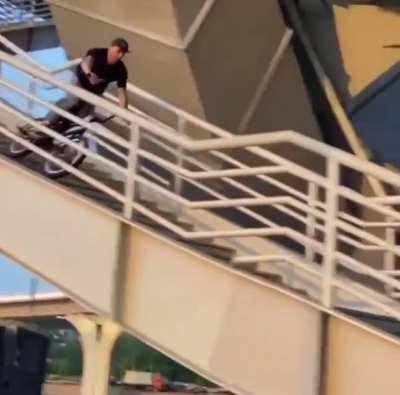 Riding a bike down a huge stair set with no helmet…