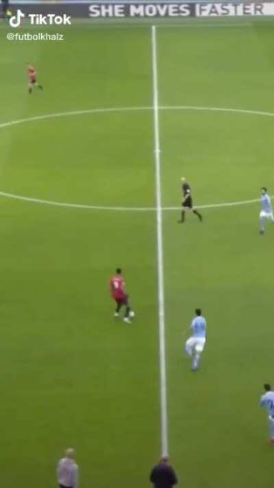 Martial dribbling past Ruben Dias