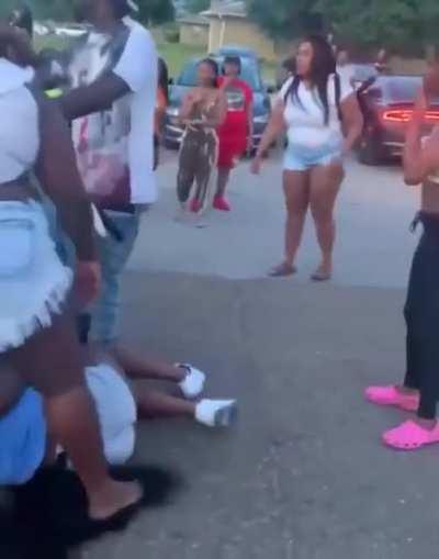 After a street brawl kicks off, wigs start flying all over place