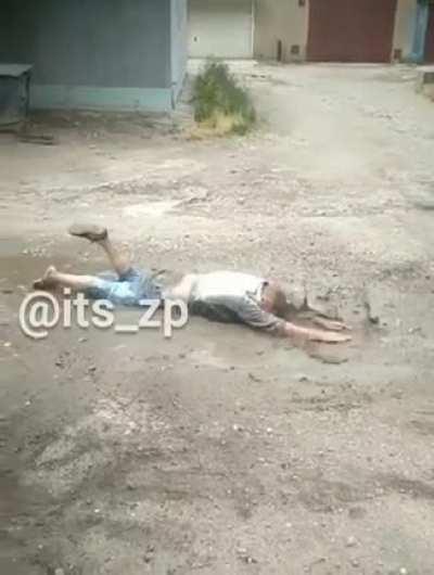 A man is being chased and tries to swim away