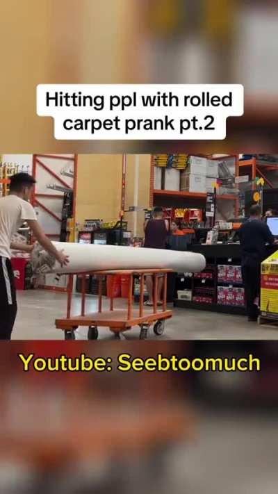 Prankster hits people with carpet for content