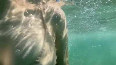 Slow-mo GIF of Alexandra Daddario swimming in bikini in YouTube video