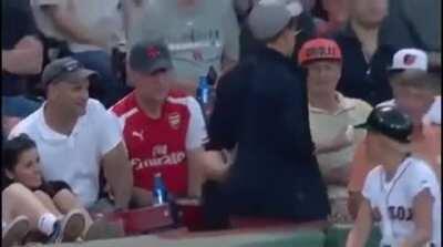 This guy gets a ball at a Red Sox game. Then he gives it to a young kid a few seats away