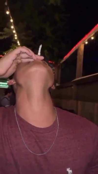 Guy learns how not to smoke a cigarette.