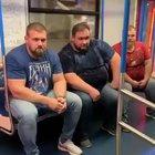 3 dudes getting off the subway.