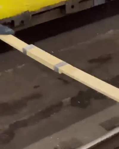 Trying to cross subway tracks on a ducktaped bridge