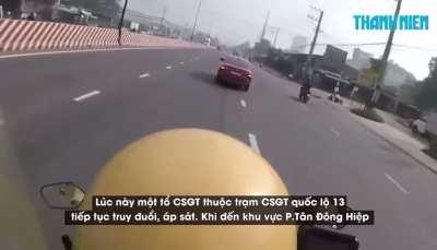 Car robber (red car) was being chased by traffic police and crased into a yard