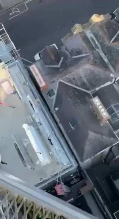 Crane operator takes dump in bag - drops it onto the roof of someone's house in Dublin.
