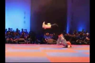 Chun Li cosplayer reenacts the character's moveset from SFxTekken during Capcom event