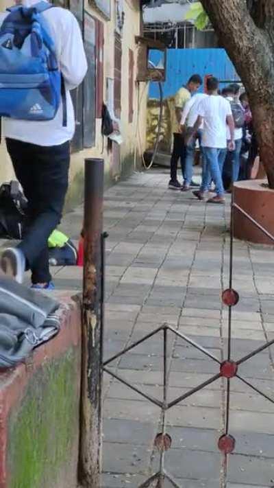 A fight near my college, later on the white shirt guy bangged the other guy with a cricket bat