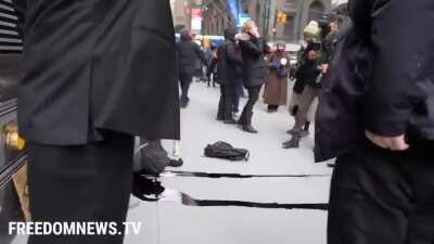 Environmental protestor falls from NY building he was climbing. A can of black paint in his backpack explodes upon impact, polluting the sidewalk and gutter. (He survived)