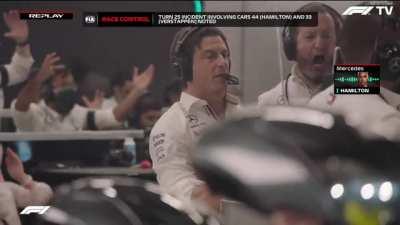 A slo-mo shot of Toto Wolff's reaction to Lewis Hamilton and Max Verstappen colliding