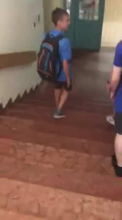 This kid going down the stairs