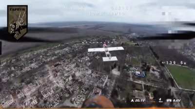 Footage of a Ukrainian UAV armed with a shotgun shoots down a Russian Molniya kamikaze drone.