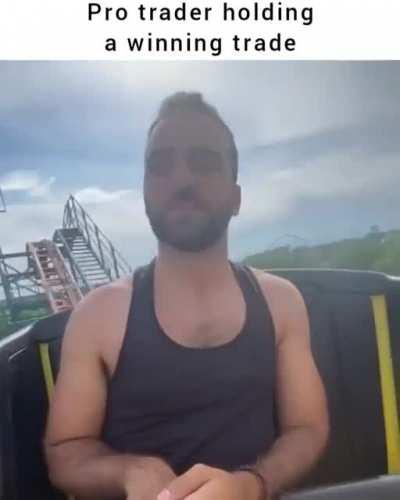 Pro trader holding a winning trade: