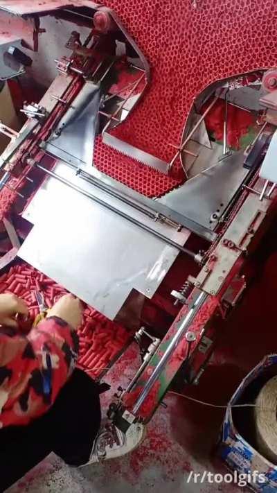 Firework shell-stacking machine