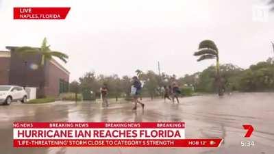 Cameraman Drops Camera to Run to Help People Fleeing Hurricane Ian