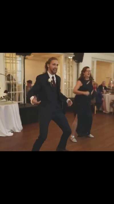 Mom and son dance at a wedding.