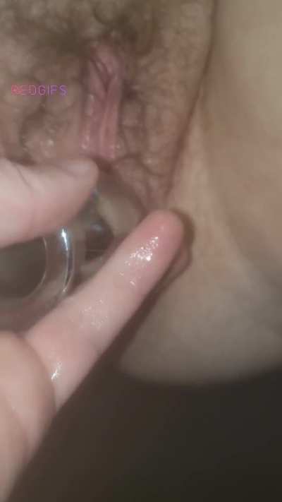 Pushing a tunnel plug out of her loose cunt