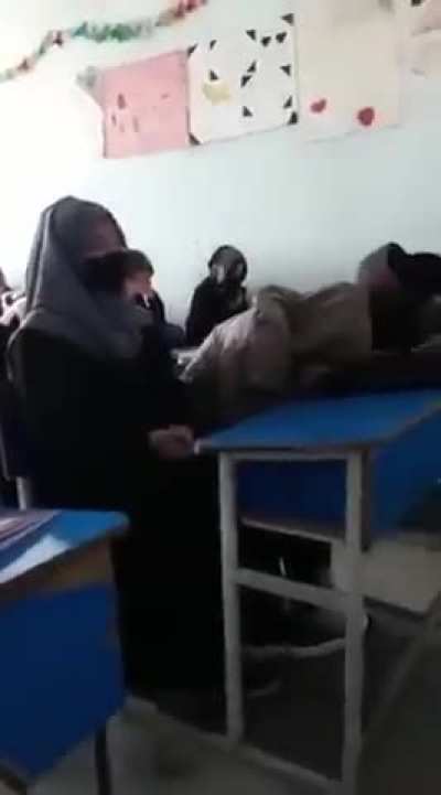 Afghan women crying after being banned from universities