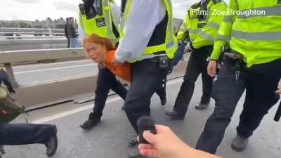 How to do a media interview while being carried away by police for protesting