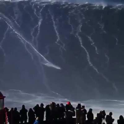 This surfer compared to an 80ft Wave