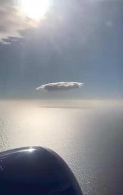 A lonesome cloud roaming the endless sky