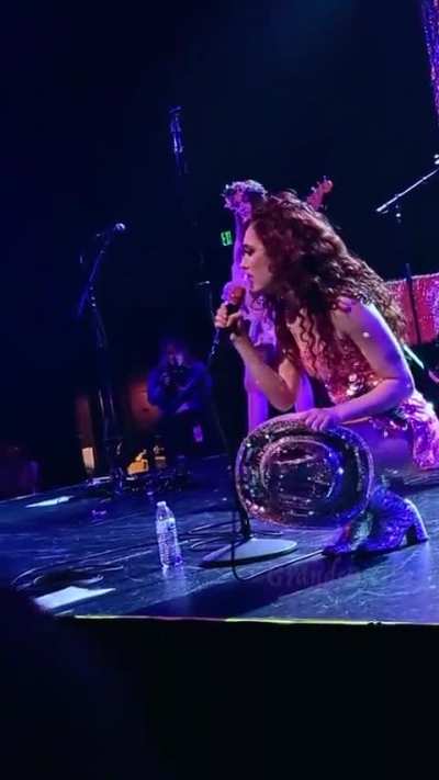 Guys, I don't think that was a microphone she threw into the crowd