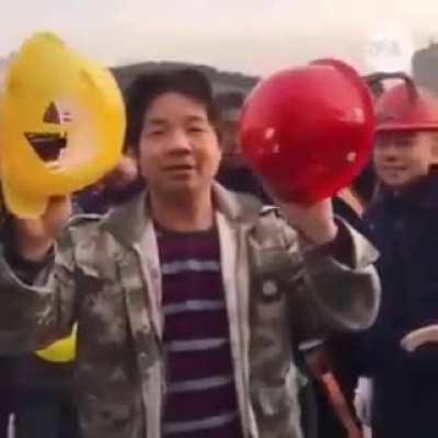 Chinese worker's helmet vs. his boss' helmet