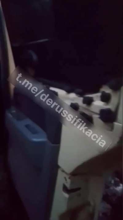 Russian soldiers evacuate two of their comrades. One of the soldiers is already roasted