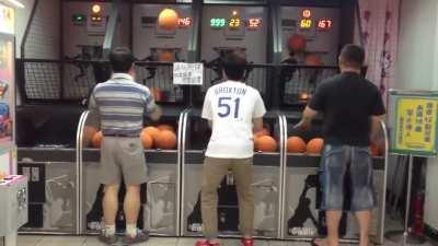 Two handed man scoring on the net.