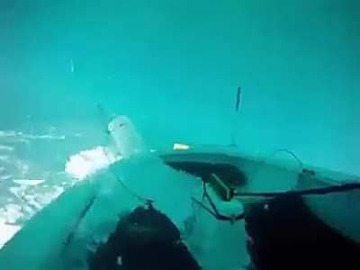 Kid recovers sailboat after capsizing