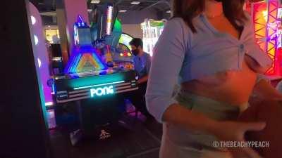 Oops, my boobs keep popping out at the arcade