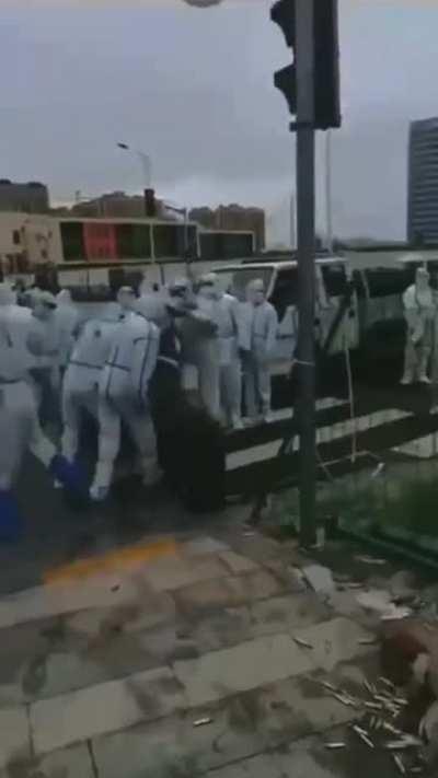 People in hazmat suits 