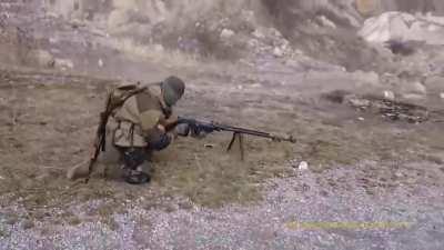 shoulder firing a Simonov anti-tank rifle