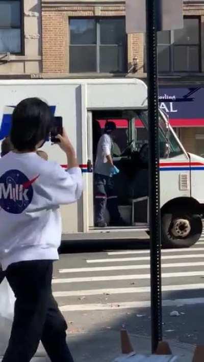 USPS workers taking a bow as they are cheered in Bk