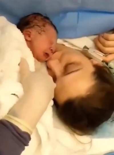 Newborn baby's reaction to his mother's first kiss is priceless.
