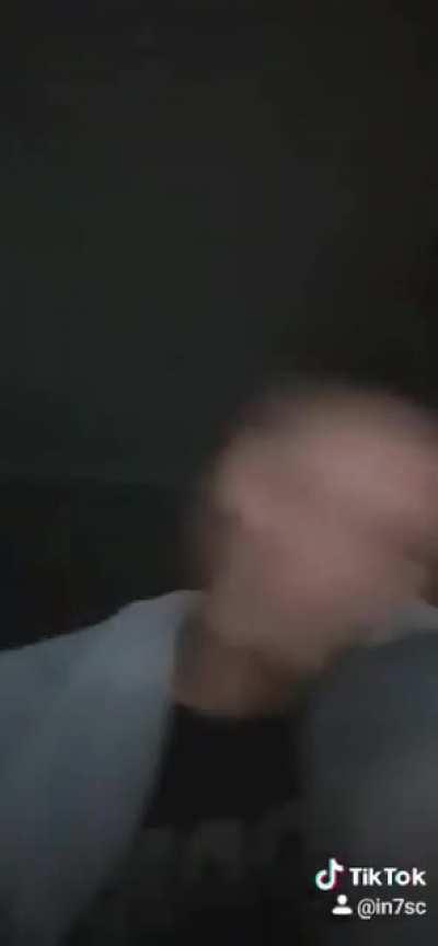 idiot falls out from chair while spinning his head