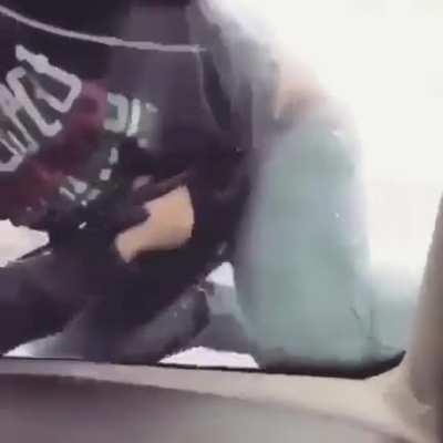 Guy tackles and fights a car