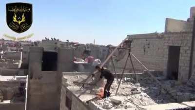 Syrian rebels use a crude trebuchet to launch burning pitch towards government positions - Damascus 2013