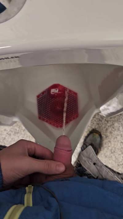 Pissing in a public gas station urinal from my soft blonde uncut dick hehe i first had sex at 30