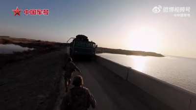 An anti air missile battery(either S-300 or HQ-9, can somebody tell me) of the PLAAF air defense force sets up battle positions in the gobi desert. November 2025