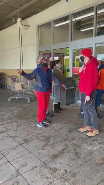 A crowd of angry people attempt to enter a grocery store (HEB) in Texas.