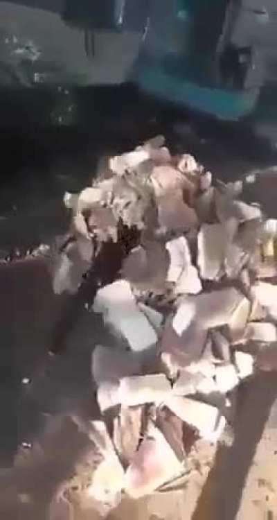 A huge lump of debris almost fell onto a worker's head.