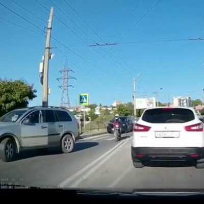 This stupid Volvo driver mistook a cycle guy for a guy on a bike!