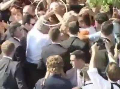 Albanians stealing Bush's watch.