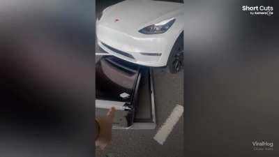 Elderly Tesla driver knocks over and drags charging station 