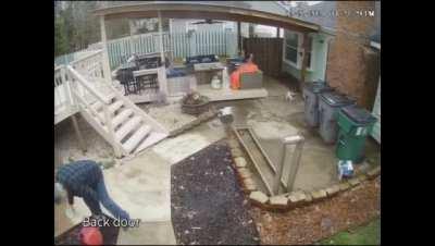 Dog spectates owner failing miserably at trying to light bonfire with gasoline.